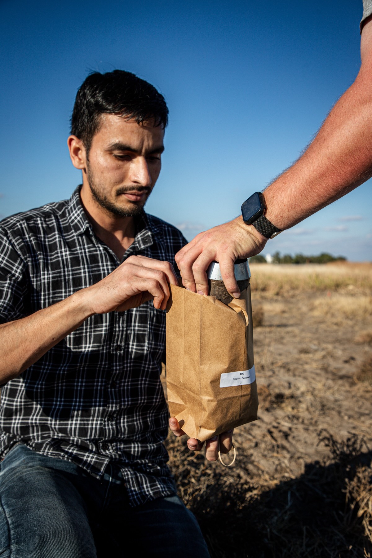 picture of Sachin takign soil samples